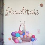 The Abuelita's sign and yarn basket at the shop entrance